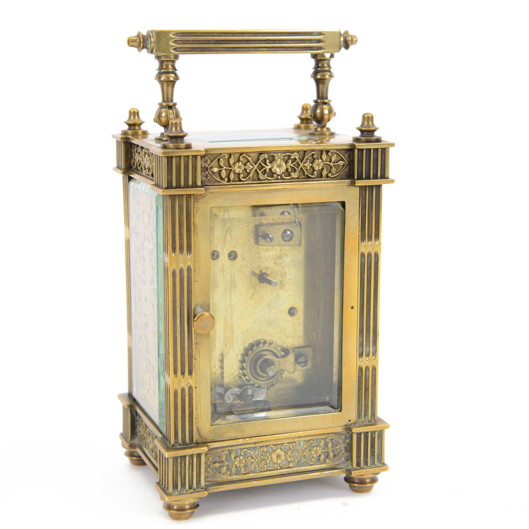 French - Matching pair of Edwardian 8-day timepiece carriage clocks with bevelled rectangular glass panels and overlaid friezes in gilt repousse work with fretted dial masks,  circular enamel chapter ring with Arabic numerals and steel spade hands, both clocks with single train movements, one movement with a jewelled cylinder platform escapement and the other with a jewelled and silvered lever platform escapement.
No Keys.