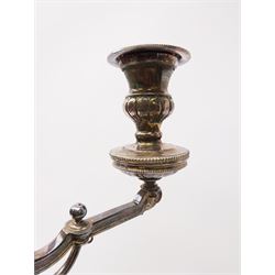 A large Victorian Thomas Bradbury & Sons silver plated candelabrum, the circular base with flower head border upon three domed feet, supporting a central knopped and fluted column flanked by three zoomorphic creatures, leading to a central socket with removable nozzle above a large palmette detailed drip pan, and three scrolling branches with conforming sockets and nozzles, with maker's silver plate mark and Victorian registration lozenge beneath, H62.5cm