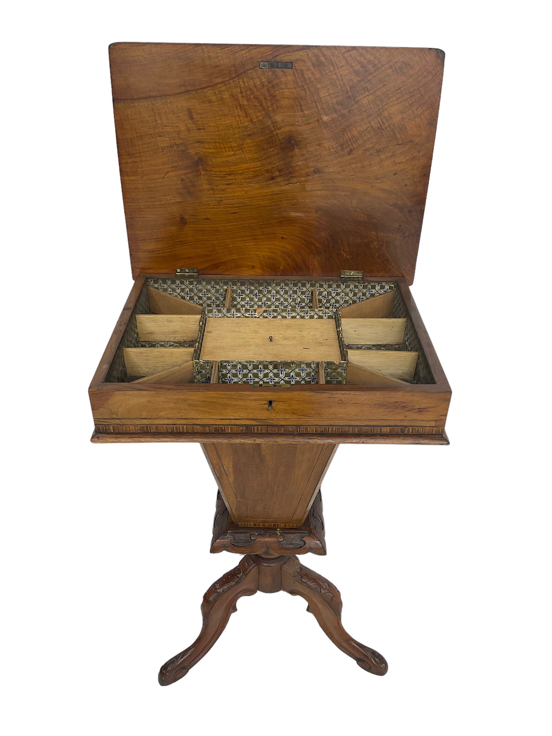 Victorian walnut work table, the rectangular hinged top inlaid with a chessboard design, canted edge with alternating ebony and satinwood inlays, concealing fitted interior, banded and strung frieze over tapering column well, collar carved with foliate decoration, on a cabriole tripod base