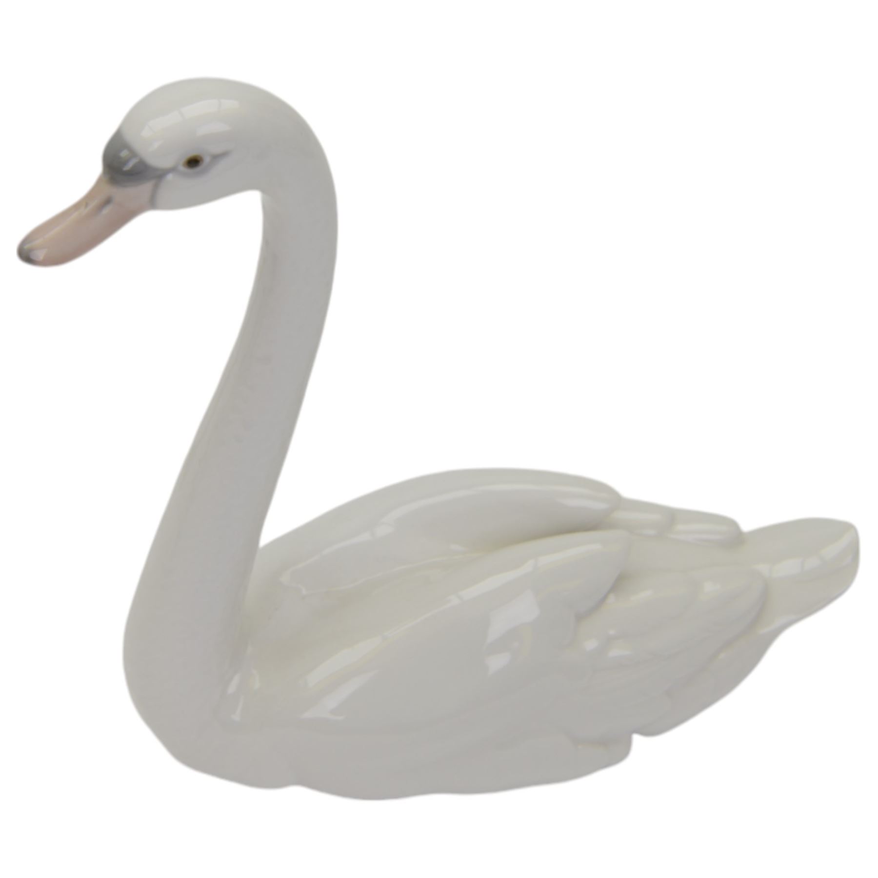 Nine Lladro figures, including  Polar Bear figure group no 1443, three polar bears, swan etc 