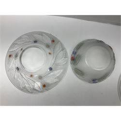 Two French pressed glass bowls of shallow circular form, relief moulded with flowers and foliage, together with a matching charger, largest bowl D34cm  