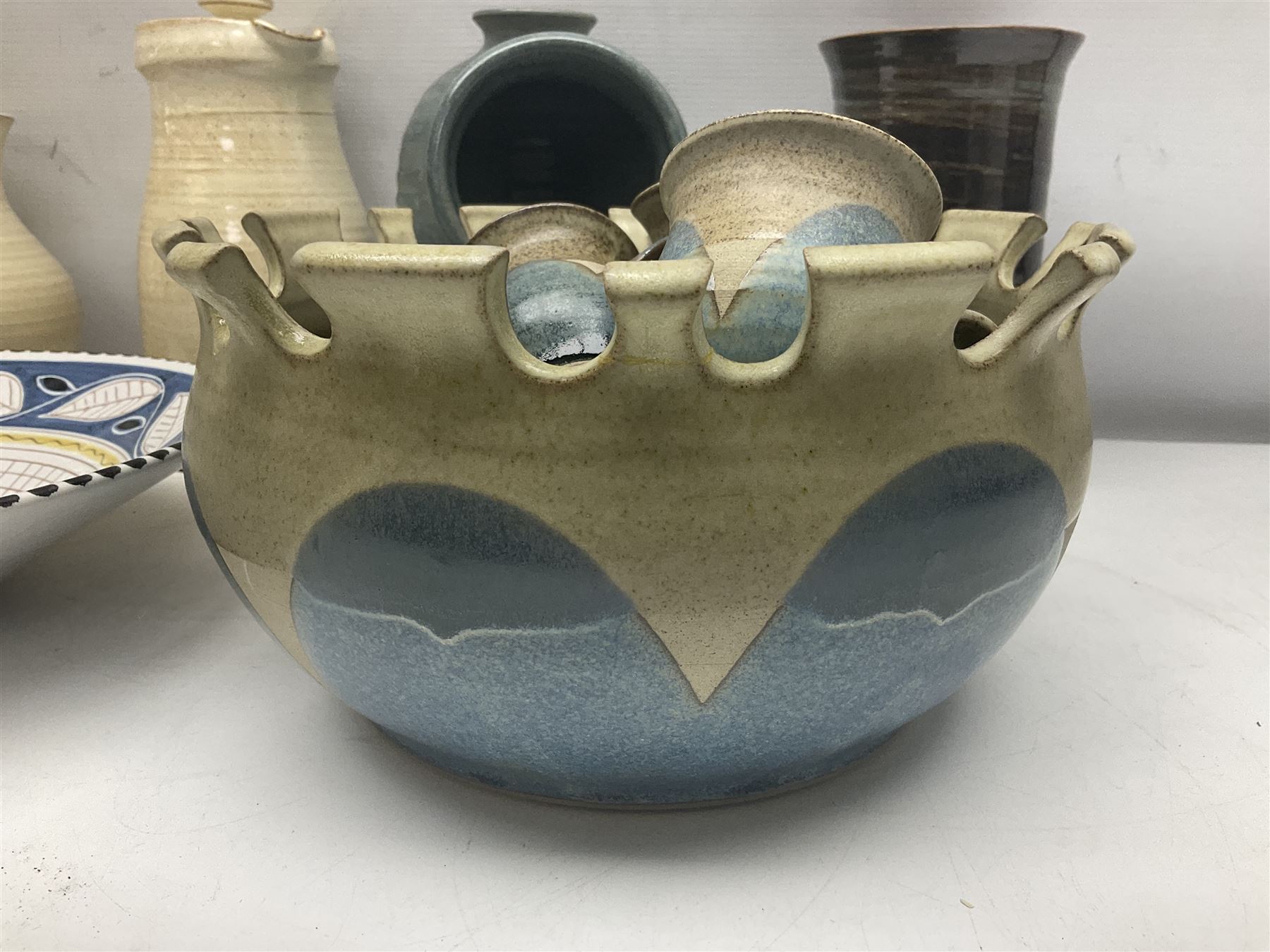 Collection of studio pottery, including Punch set with eight cups, two Paul Murray jugs, dishes, etc 