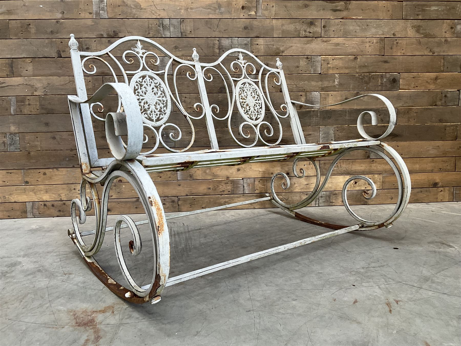 Wrought metal rocking garden bench seat, in antique grey finish