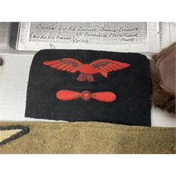 WW1 British Army Derby Scheme 1915 Attested armband; beret with East Yorkshire cap badge; pair of fur lined leather flying/motorcycle goggles; HMS Pembroke cap band; and small quantity of RNAS cloth and metal badges etc