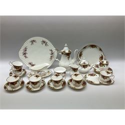 Royal Albert Old Country Roses pattern tea set, comprising teapot, coffee pot, six teacups and six saucers, five side plates, further teacup with joined saucer and side plate, open sucrier, milk jug, cake plate, and preserve pot and cover, together with Royal Albert Jubilee Rose pattern sauce boat and stand, and Royal Albert Lavender Rose pattern cake stand. 