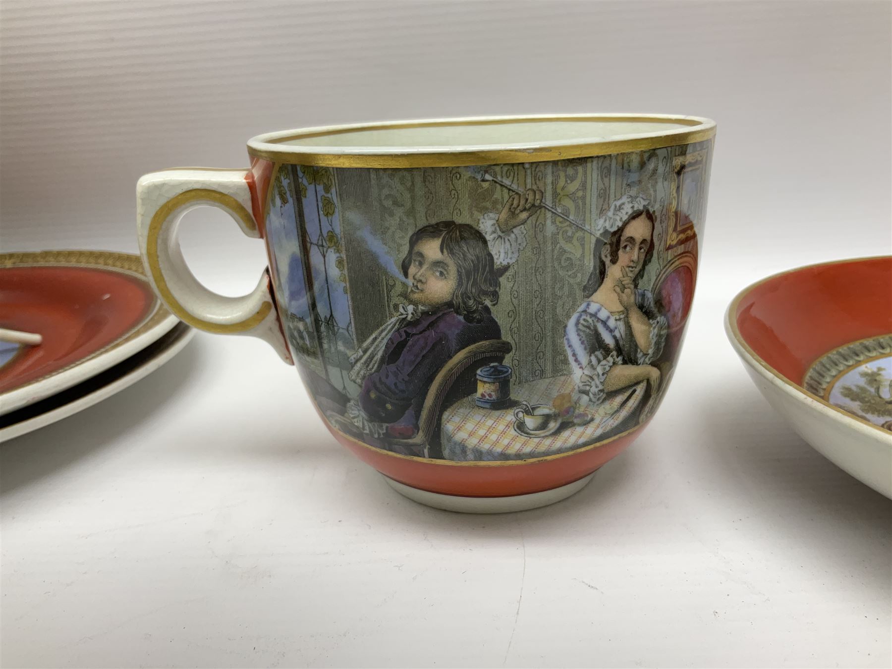 19th century Prattware table ware to include an oval footed dish decorated with a scene after Landseer 'Highland Music', retailed by James Muggleton L27.5cm, ‘The Truant’ plate after T. Webster, 'Blind Man's Buff' & 'Snap Dragon' tea plate, two side plates with malachite printed borders and others (17)