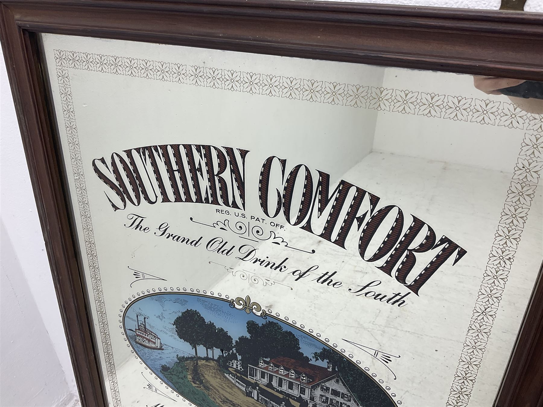 Southern Comfort advertising mirror, together with a framed star sign print, mirror H90cm