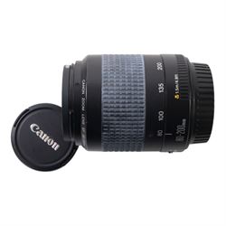 Eight camera lenses, comprising Canon Ultrasonic Zoom EF 75-300mm 1:4-5.6 lens, AF Nikkor 35-70mm 1:3.3-4.5 lens, Nikkor 60-180mm 1:4.5-5.6 lens, Canon Zoom EF 28-80mm 1:3.5-5.6 lens, Canon Zoom EF 80-200mm 1:4.5-5.6 lens, Sigma 70-300mm 1:4.6-5.6 DL Macro, Sigma Zoom 70-210mm 1:4-5.6 UCII lens and a Sigma AF 70-300mm 1:4-5.6 APO Macro lens, all with lens caps