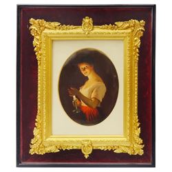 19th century Hutschenreuther porcelain plaque, of oval form painted with a young girl holding a chamber stick and illuminated by the candlelight, with collectors label titled 'Good Night', impressed MR mark for Hutschenreuther and single digit size code '3' verso, within gilt foliate frame and mount, encased within a further ebonised box frame with burgundy velvet lining, plaque H17cm W13cm, box frame H34cm W29cm 