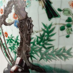 Late 19th century Chinese famille verte crackled ice pot and cover, of ovoid form, decorated with birds, blossom and bamboo, the cover with handle formed as a root, with hardwood display stand H50cm