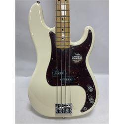 Fender Precision Bass guitar, in Olympic White finish with tortoiseshell effect scratchboard, serial no US15103092, in black Fender hard case with Fender strap and warranty card, guitar L116cm