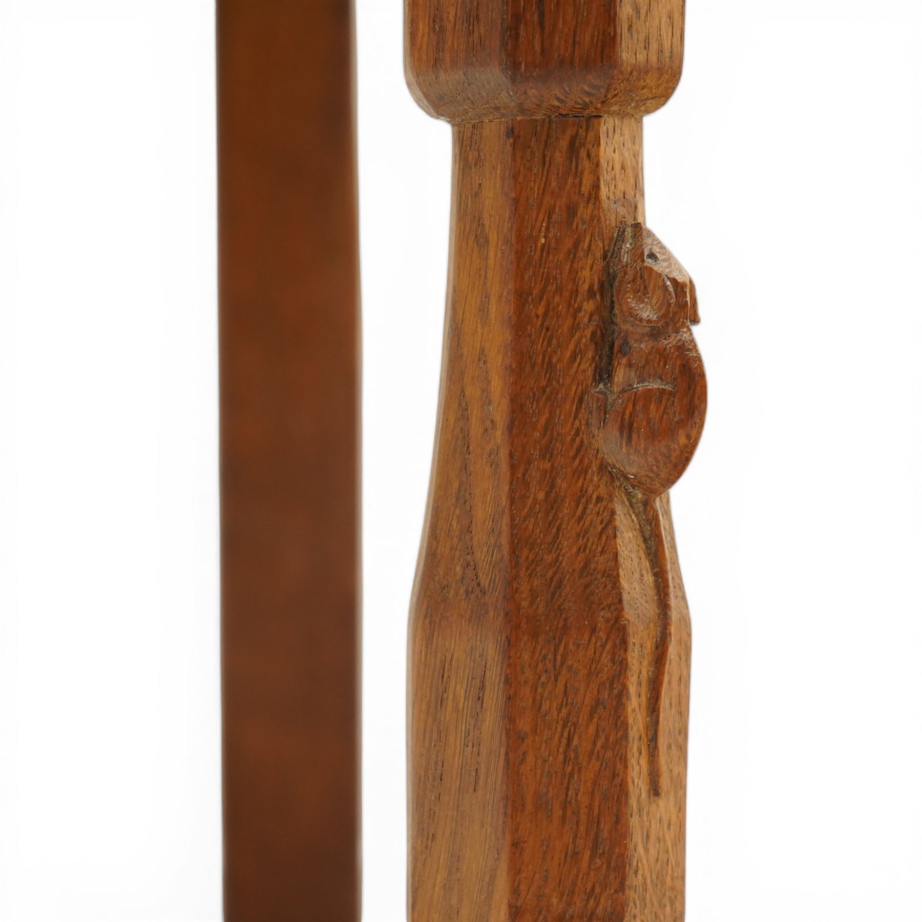 Mouseman - oak panel back carver armchair, lightly adzed panel back above a tan seat with brass studded trim, flanked by swept arms raised on octagonal front supports, with carved mouse signature, by the workshop of Robert Thompson of Kilburn