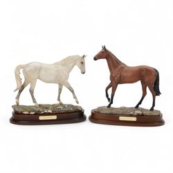 Two Royal Doulton horses, Desert Orchid and Red Rum, on wooden plinths 