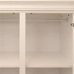 Modern white painted double wardrobe, fitted with two panelled doors, enclosing a hanging rail and shelving, raised on bracket feet