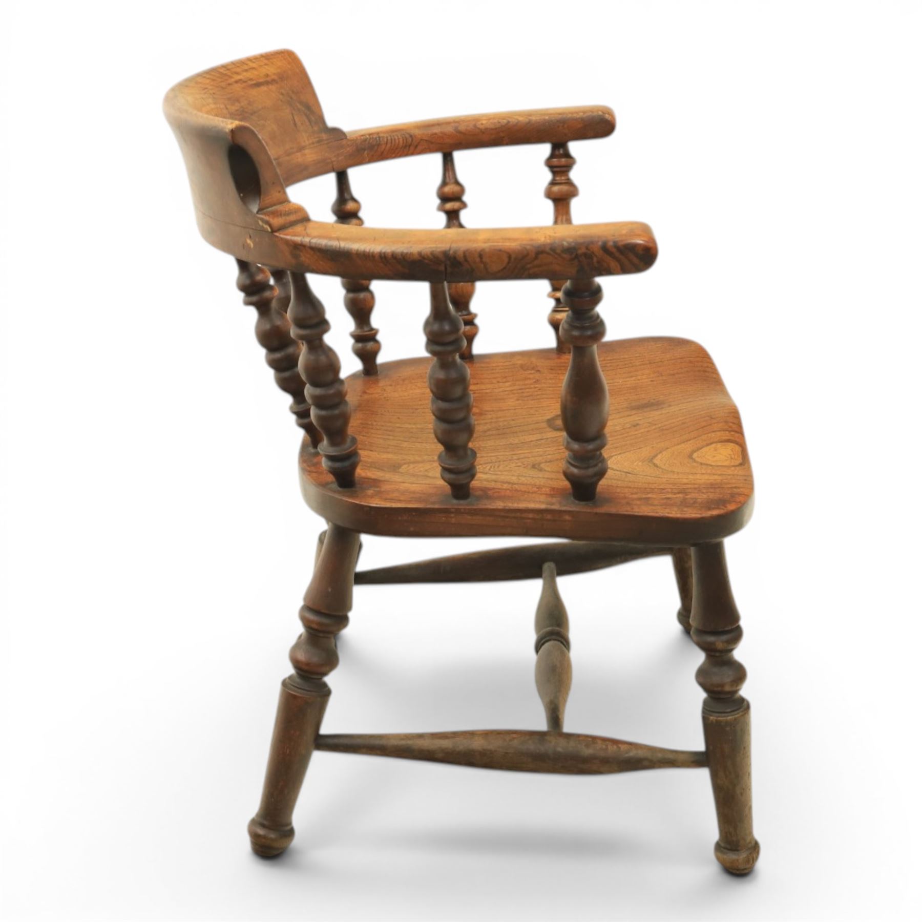 Early 20th century elm smoker's bow or captain's chair, elm dished seat raised on turned supports