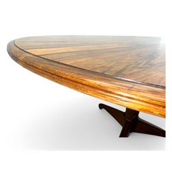 Andrew Milne for Heals - mid-20th century extending dining or boardroom table, oval top with one additional leaf, raised on twin tapering pedestal supports terminating in tripod feet