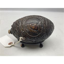 19th century bug bear flask carved with Balkan figures, a wolf and leafage with glass eyes, L14cm on stand 