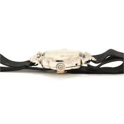 Art Deco French ladies platinum black onyx and diamond manual wind wristwatch, silvered / white dial with Arabic hour markers, old cut diamonds and onyx set bezel, diamond set lugs and crown, case No. 80639, hallmarked