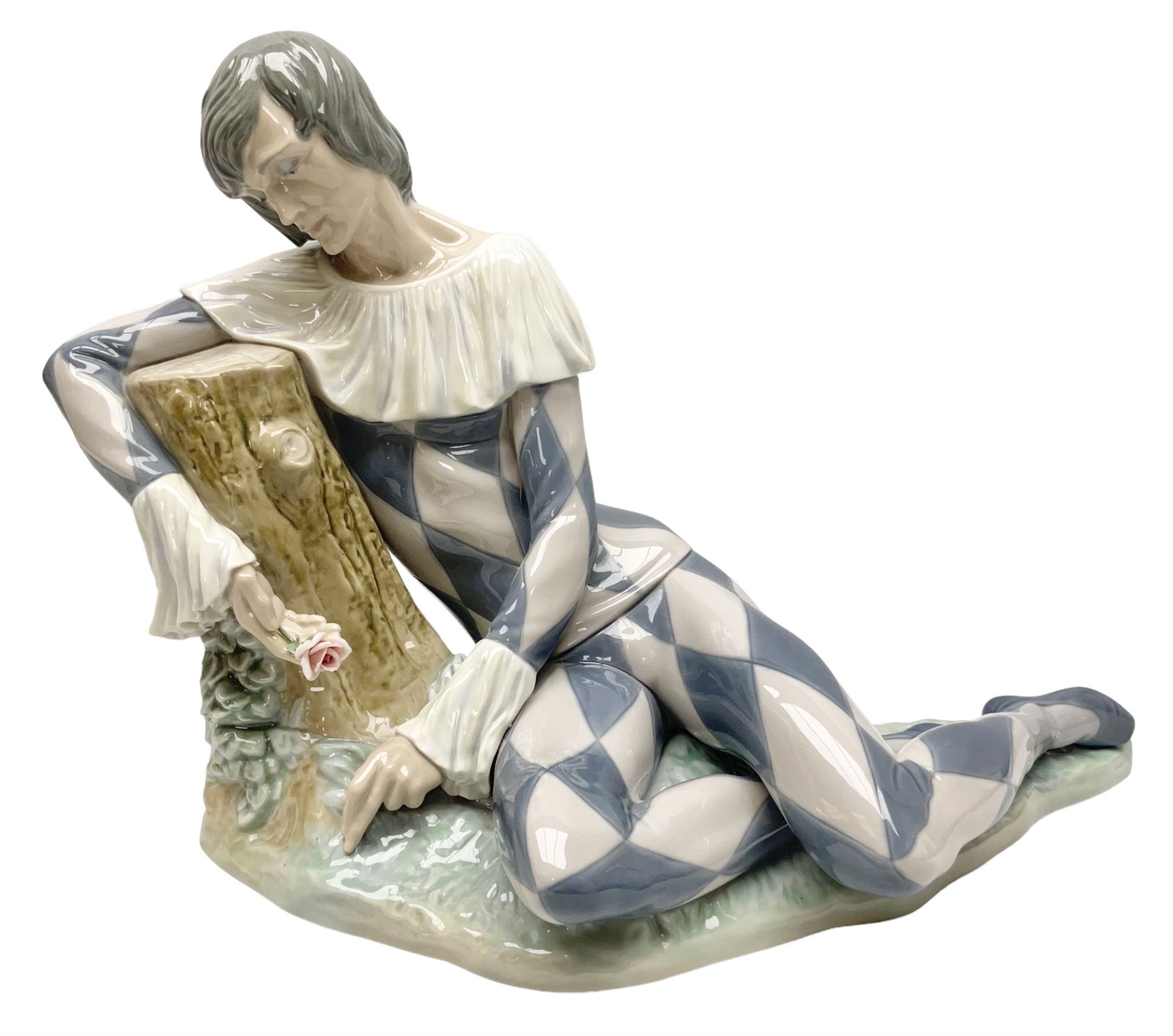 Lladro figure, Harlequin Reclining, modelled as a recumbent harlequin, no 5128, Sculpted by Salvador Furio, year issued 1982, year retired 1987, H28cm 