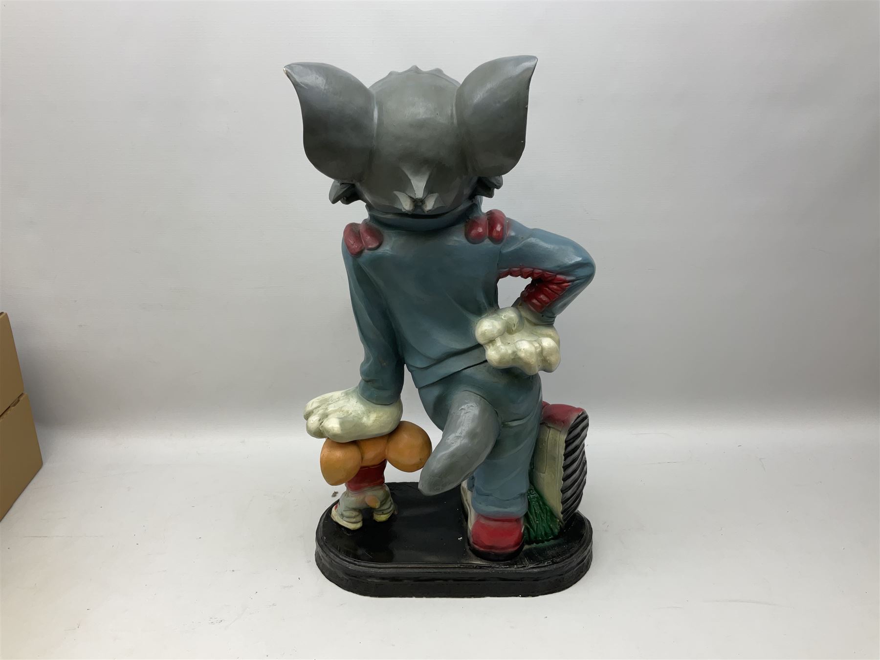 Fibreglass promotional/advertising group of Tom & Jerry, Tom standing wearing a blue track suit with his left hand resting on Jerry's head H63cm
