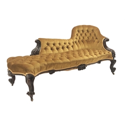 Victorian walnut framed chaise lounge, with carved scrolled acanthus leaf arm terminals, upholstered in deep buttoned yellow velvet, scroll carved apron and cabriole legs with brass castors,  W198cm  