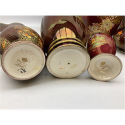 Two Crown Devon Rouge Royale pattern large temple jars with temple dog finial to lid, together with seven other Crown Devon ceramics and two lidded Carlton Ware temple jars in Red Royale, tallest example H47cm (11)