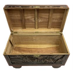 Mid-20th century Singapore camphor wood blanket chest, heavily carved depicting battle scenes and cityscapes 