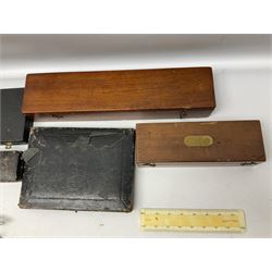 J Halden & Co brass sliding rule in a mahogany box, together with cased wooden ruler set, and other cased drawing sets and equipment 