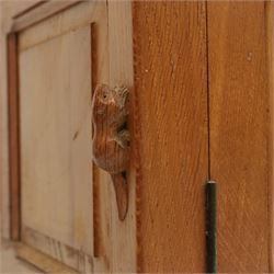 Beaverman - oak double wardrobe, enclosed by twin multi-panelled doors, Yorkshire Rose carved handles, the interior fitted with shelf and hanging rail, with signature carved beaver, by Colin Almack of Sutton, near Thirsk