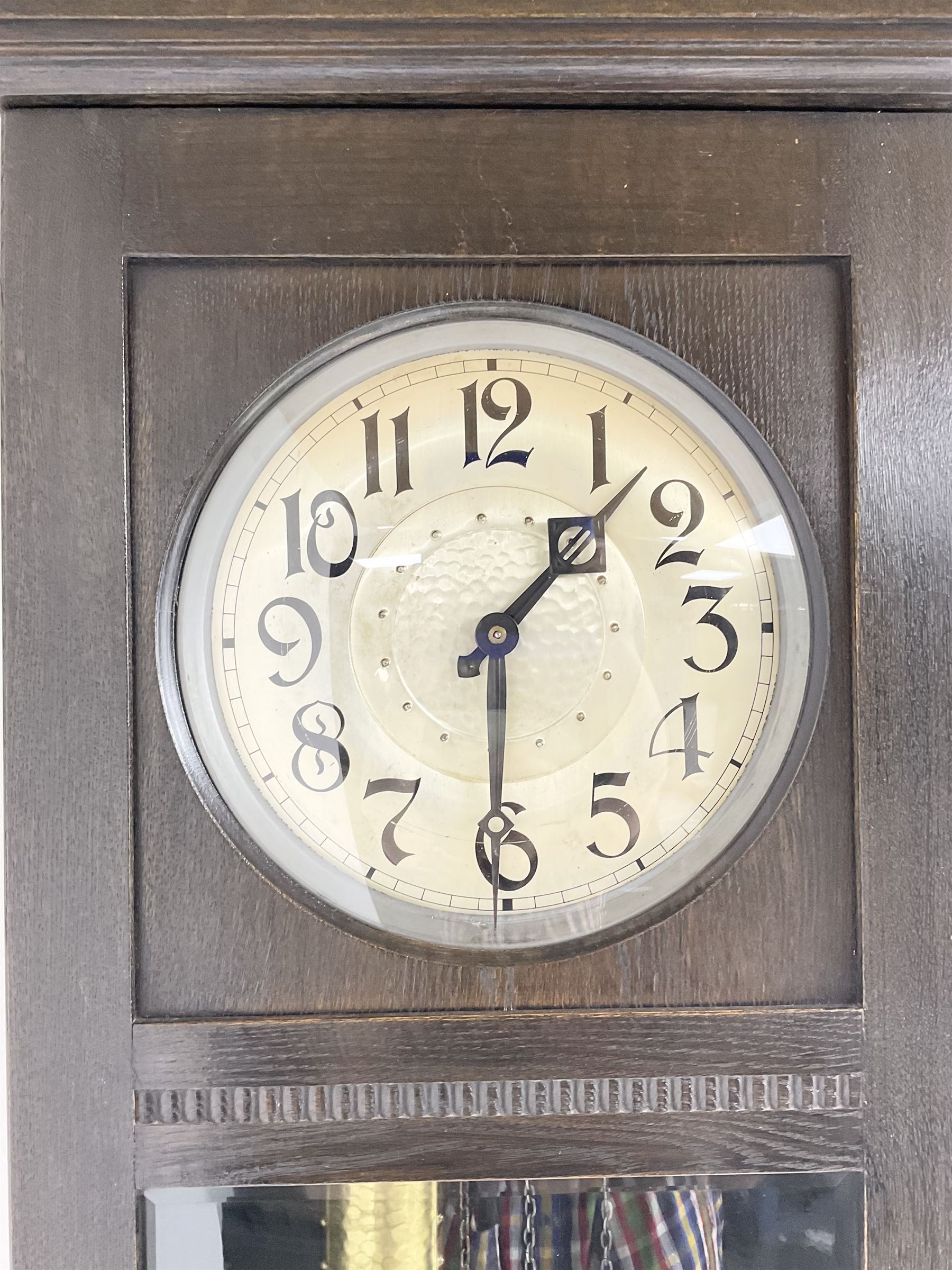 20th century Art Deco- oak cased 8-day longcase clock c1930, flat topped case with a fully glazed door on a stepped plinth, silvered circular dial with Arabic numerals and pierced steel hands, chain driven twin train movement with  4 gong rods. With pendulum and two brass cased weights.
