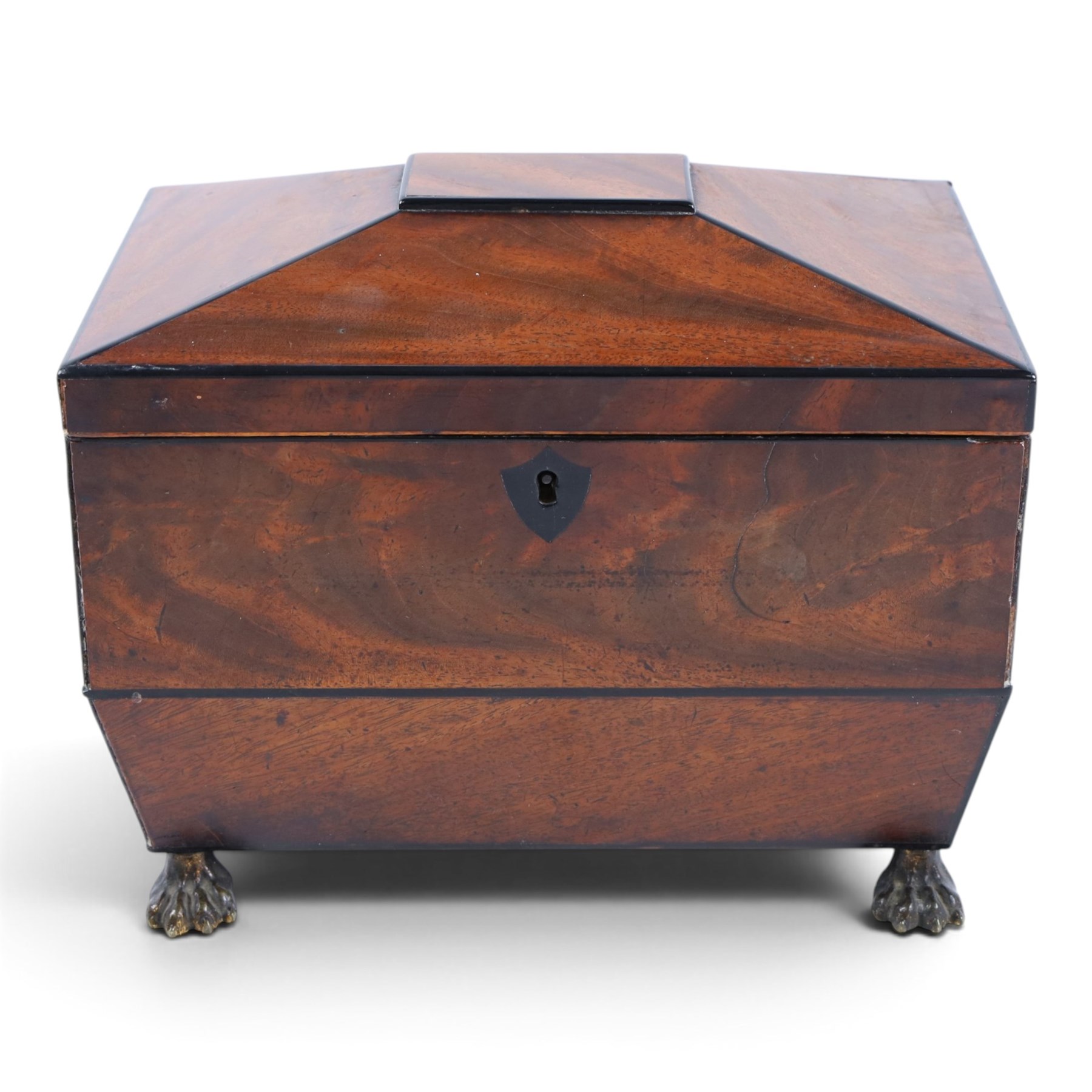 Regency mahogany sarcophagus tea caddy, the hinged lid opening to reveal two compartments, upon paw feet, H18cm