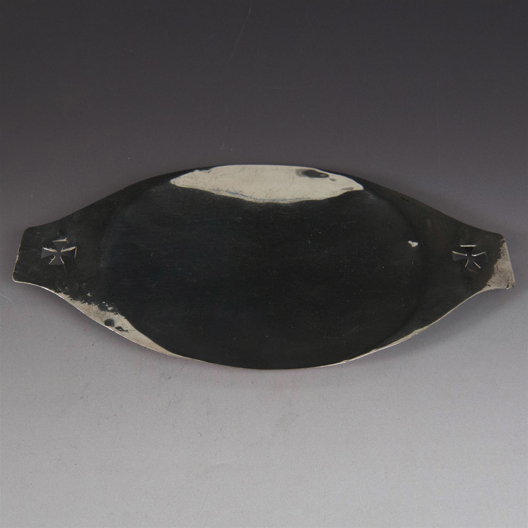 1920s silver paten, of oval form and handles with pierced cross decoration, engraved to underside 'Ex Dono Adae Moss Hill', hallmarked Blunt & Wray Ltd, London 1929, handle to handle W25cm