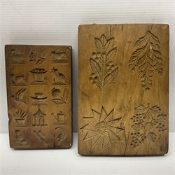 Two wooden biscuit moulds, carved loving spoon and fork, and two bradawls 