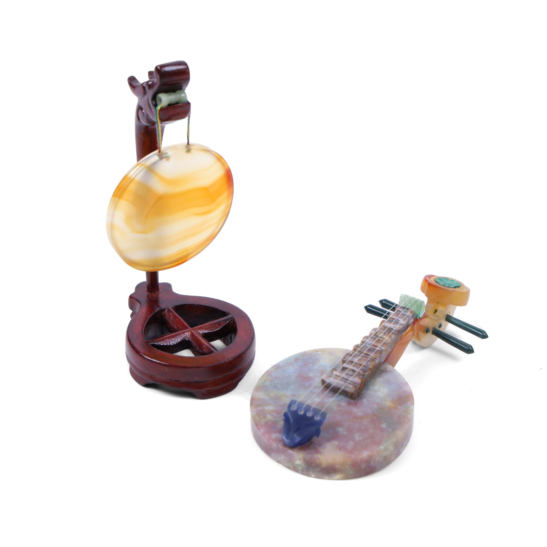 Boxed set of Chinese miniature polished hardstone musical instruments with hardwood stands