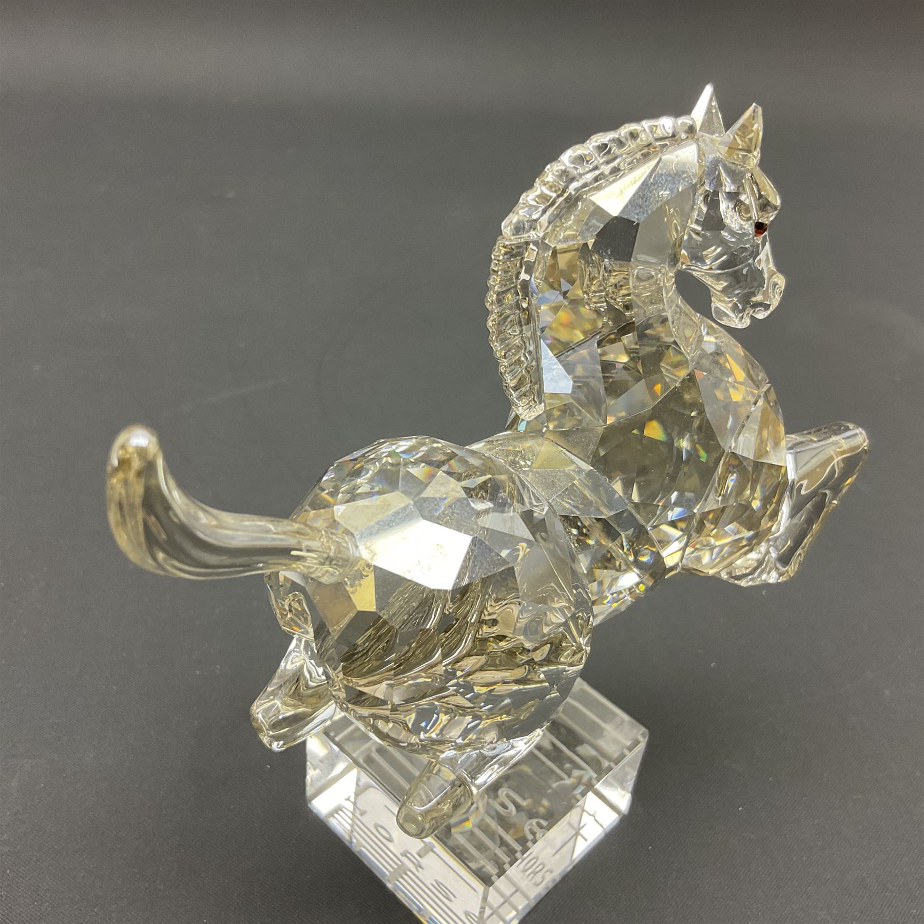 Two Swarovski Crystal Signs of the Zodiac figures, comprising horse and tiger, together with Zodiac dragon holding the flaming pearl, largest H11cm 