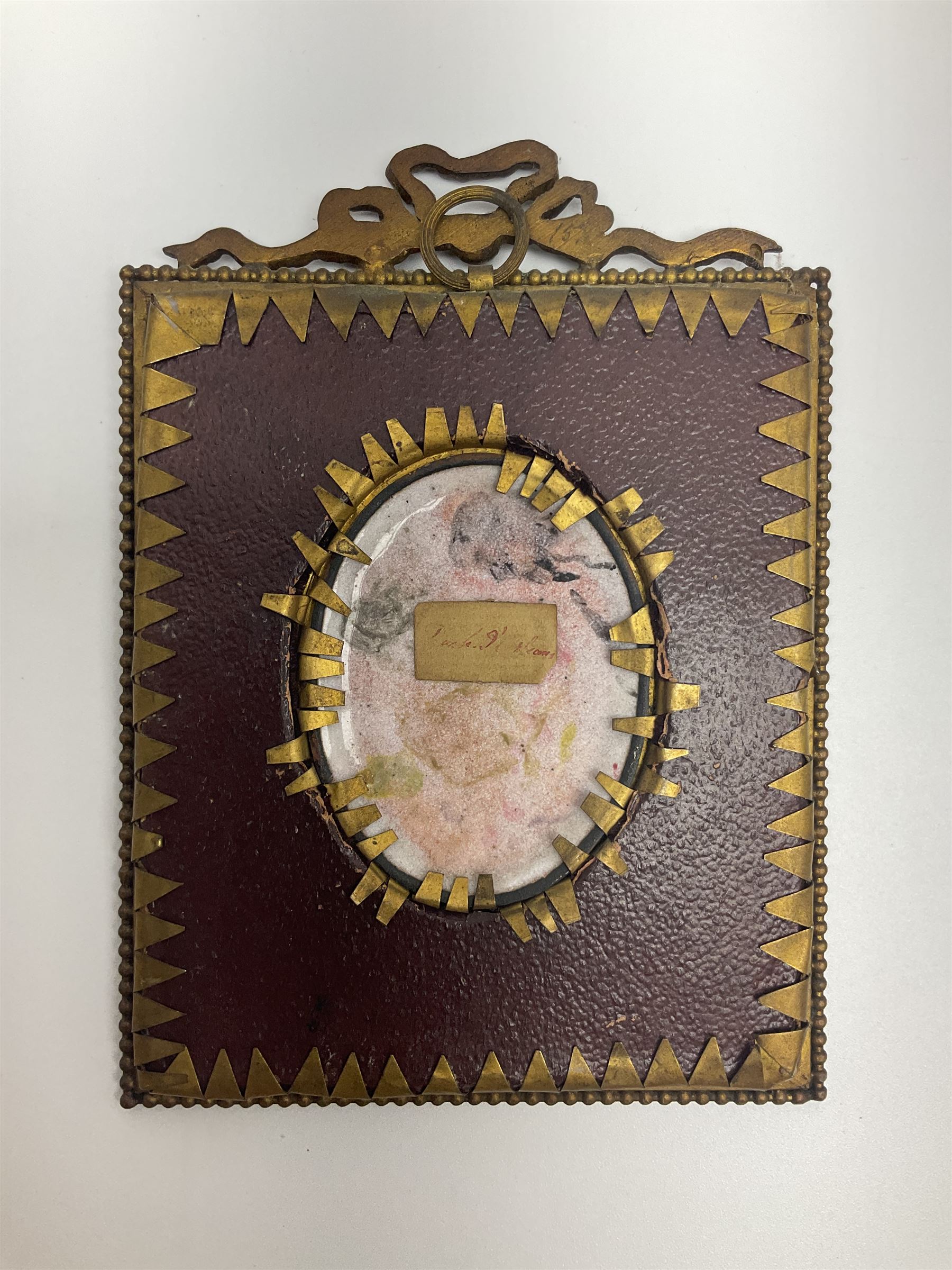 19th century portrait miniature on enamel, depicting a Georgian lady in period dress, hand painted with gilt detailing, in gilt frame with fruiting vine details, overall H13.7cm