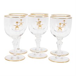 Baccarat decanter, six wine glass and six port glasses,  all with a gilt band to the rim and foot and motif for Kingdom of Saudi Arabia