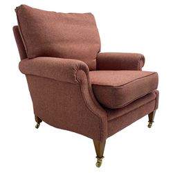 Edwardian design armchair, upholstered in wool herringbone rouge fabric, rolled arms, on square tapering supports with brass castors