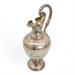 Victorian silver claret jug of baluster form engraved with Greek dithyramb panels in honour of  Dionysus, the spout with the mask of Pan, the scroll handle with birds foot terminal and with further engraved guilloche and other decoration H36cm Sheffield 1864 Maker Roberts & Belk. This item has been registered for sale under Section 10 of the APHA Ivory Act