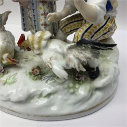Two 19th century german figures, each modelled as children feeding birds, H19cm 