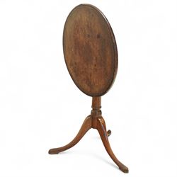 George III mahogany tilt-top tripod table, the circular top with moulded edge and inlaid edge, tilting on an iron catch above a ring-turned column, raised on three outswept legs terminating in pad feet