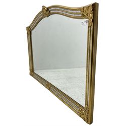 Deknudt - Regency design gilt framed wall mirror, arched shape with fleur-de-lis pediment, cushion frame