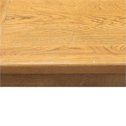 Contemporary oak extending dining table, moulded rectangular top with visible grain and inset extension leaf, pull out extending mechanism, standing on four square legs, accompanied by a set of high slat back chairs with upholstered brown faux leather seats and square tapering supports joined by stretchers