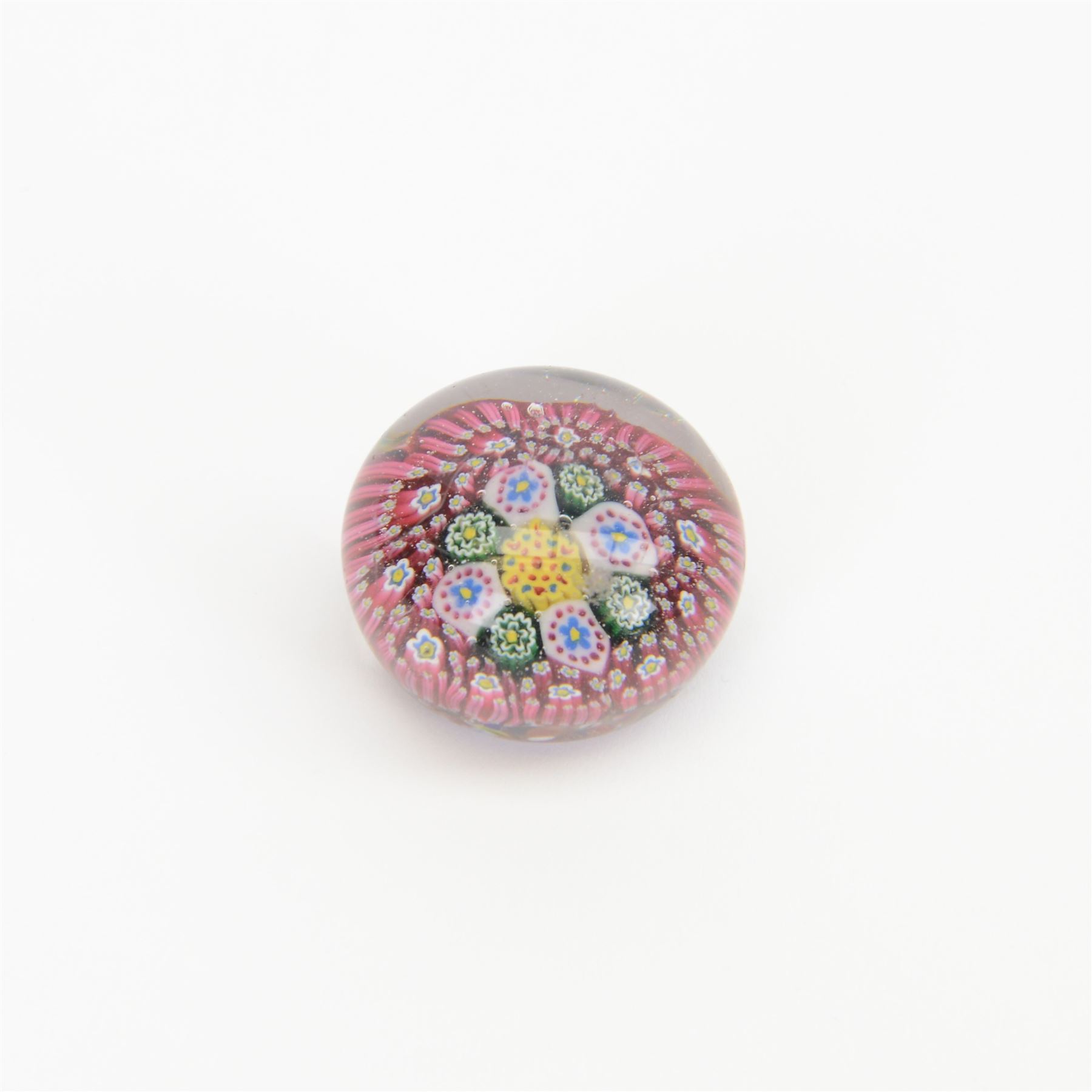 Nine miniature milleifiori paperweights including an example with twisted canes 