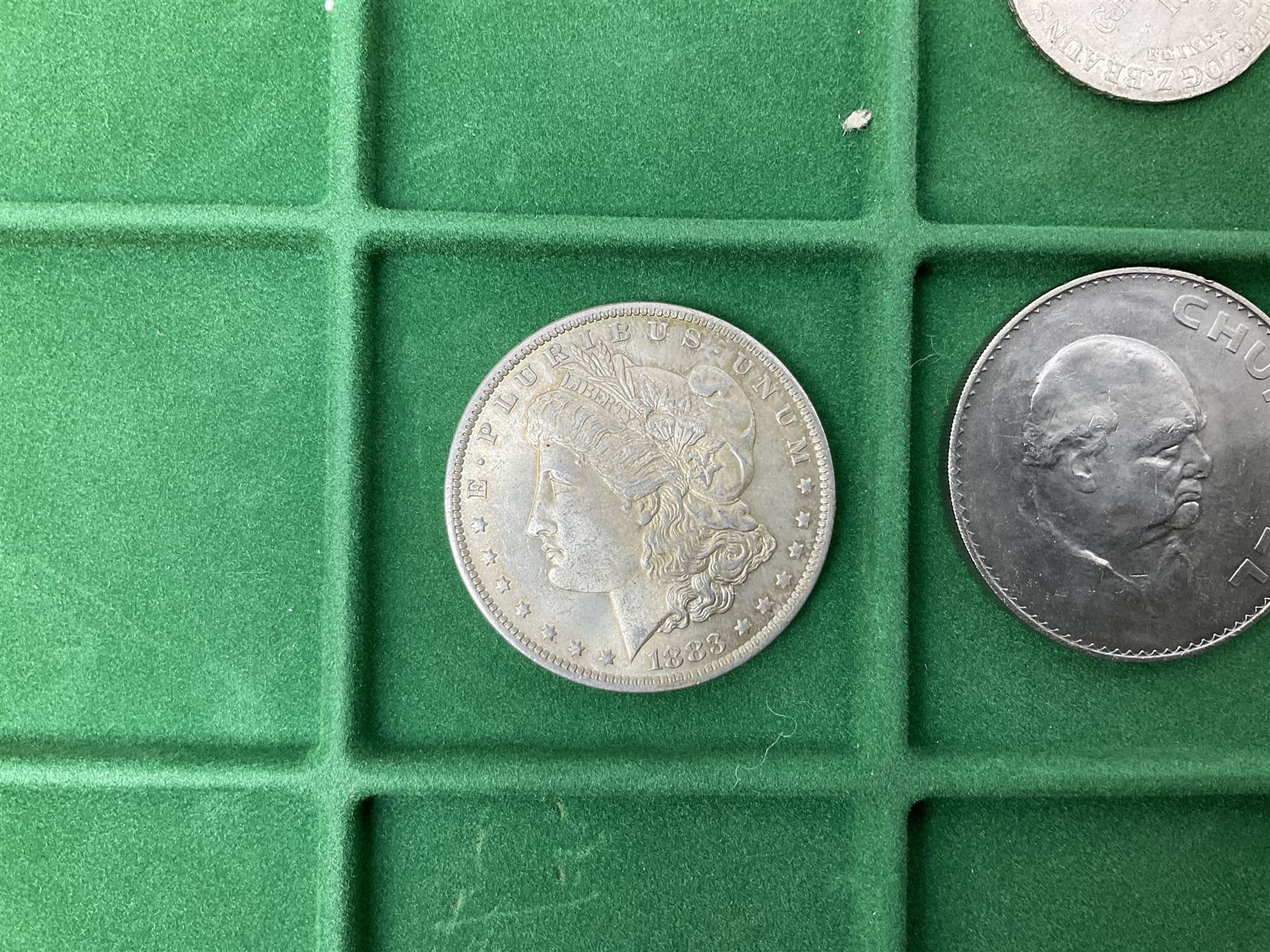 Coins and medallions including, York 1811 one shilling cattle and barber silver token, United States of America 1883O silver Morgan dollar, birds of destiny medal by Malcolm Appleby, Great British King George V 1930 halfcrown, King Edward VII 1902 silver medal, King George V 1916 halfcrown etc, housed in a case with lift out green coin trays