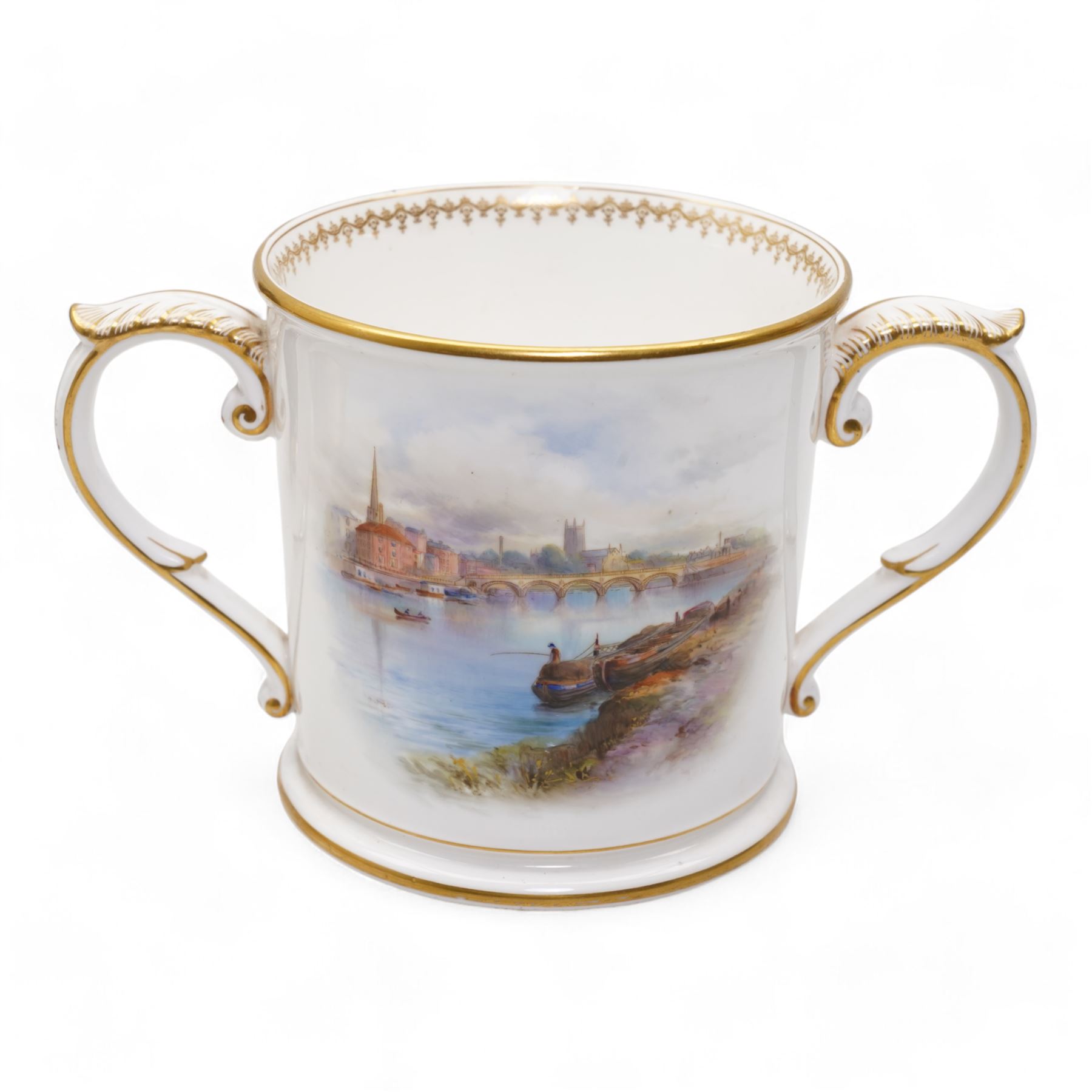 Early 20th century Royal Worcester loving cup, circa 1906, painted with a view of the River Severn and flowers to the reverse, H13cm, Grainger & Co. Worcester twin handled vase, the oval body painted in the Aesthetic style with ferns and grasses in gilt, against a cobalt blue ground, with scrolled handles and quatrefoil foot, H17cm (2)