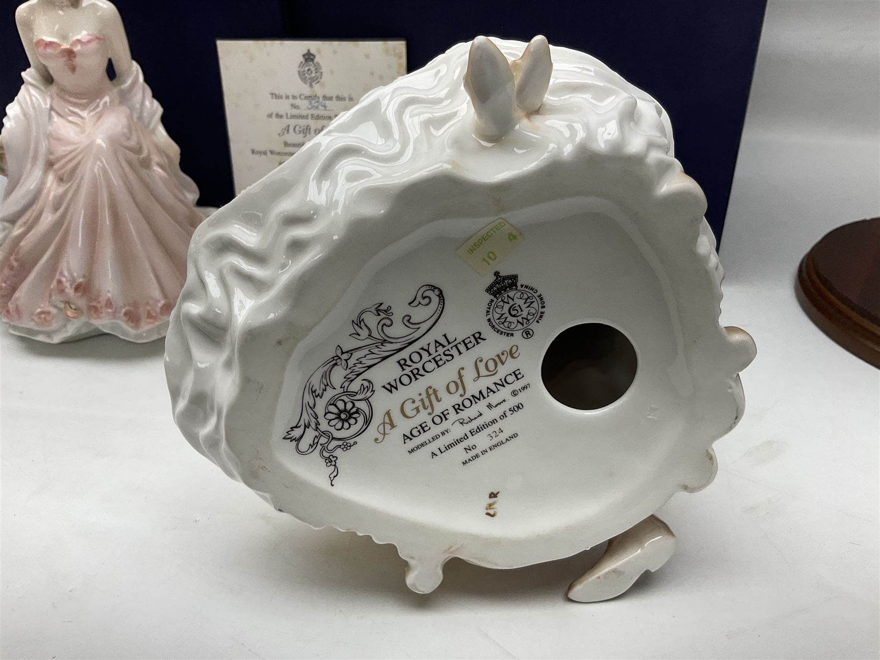 Two Royal Worcester figures, comprising A Gift of Love from the Age of Romance Series, limited edition 325/500, with certificate and original box and Royal Premier from the Glittering Occasions series, with original box 