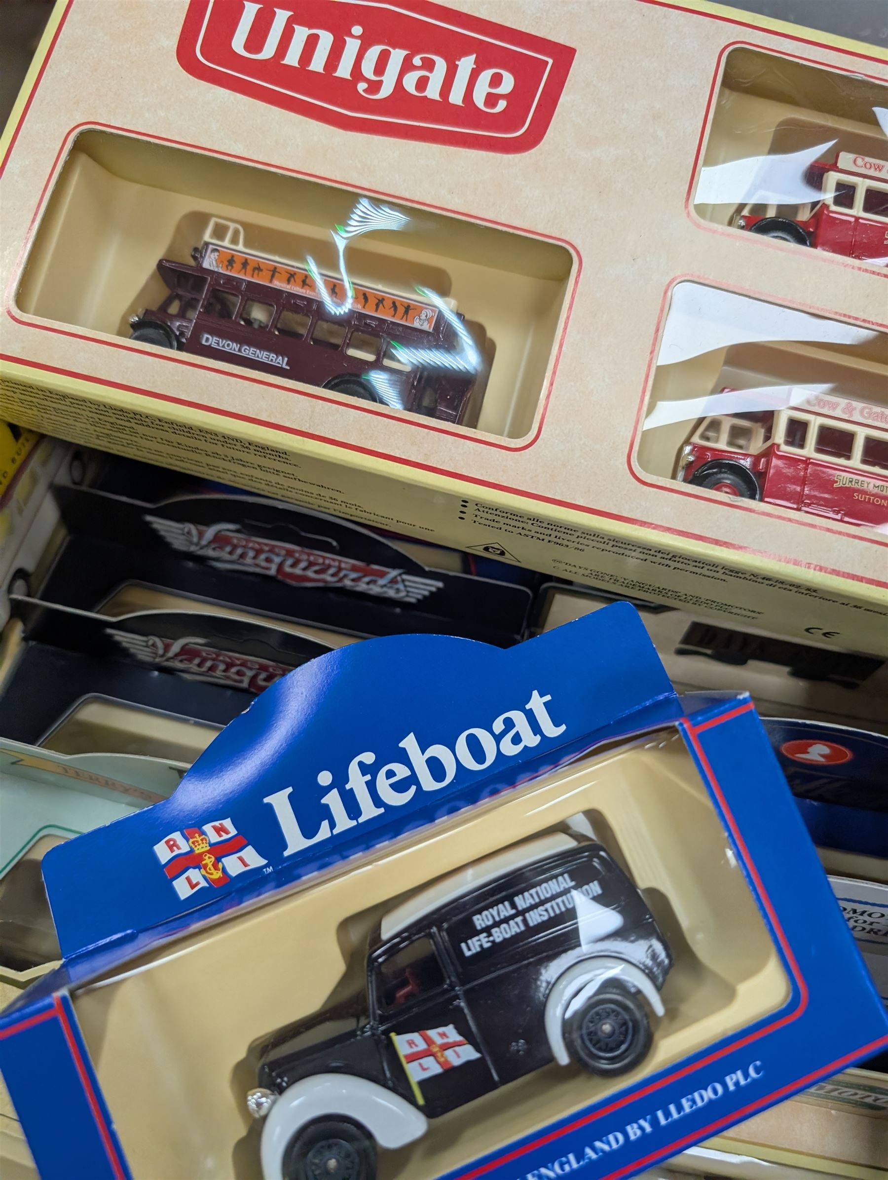 Maisto Jaguar XJ220 model car on stand and a collection of diecast model vehicles, including Vanguards, Unigate and Lledo examples