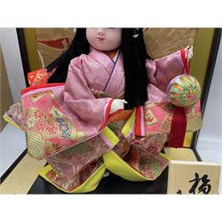 Japanese doll, dressed in traditional Japanese dress, within wooden glazed box, box H40cm
