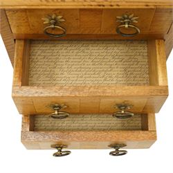Barker & Stonehouse - pair of contemporary flagstone and mango wood bedside chests, the rectangular inlaid top over three drawers with metal ring handles, on compressed bun feet